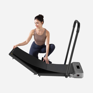 Woman unfolding the WalkingPad Z1R treadmill on the floor