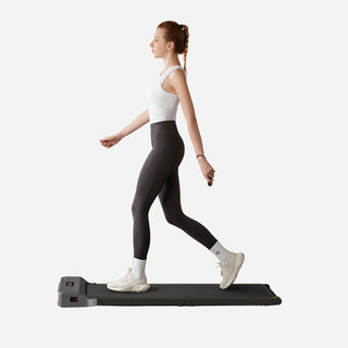 Woman walking on the WalkingPad Z1 treadmill