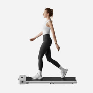 Woman walking on the WalkingPad Z1 White treadmill