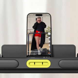Phone held upright in the holder on the WalkingPad Z3 Hybrid treadmill
