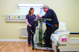 Wy'East Medical WHITNEY 52500 patient walking in the platform walker with a clinician beside him