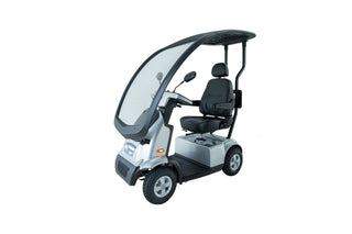 Silver Afikim Afiscooter ftc4660 C4 mobility scooter with weather protection canopy, orthopedic rotating seat, LED headlight, and outdoor mobility design.