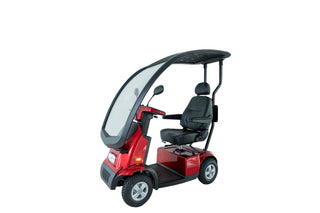 Red Afikim FTC4660 Afiscooter C4 mobility scooter with weather protection canopy, orthopedic rotating seat, LED headlight, and outdoor mobility design.