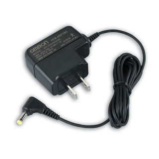 Black power adapter with cable on a white background