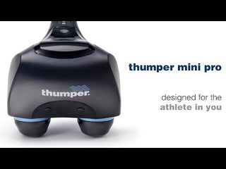 Thumper Mini Pro professional handheld percussion massager in dark gray and blue with an ergonomic long handle.
